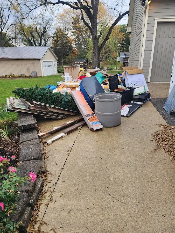 Dumpster being loaded with debris for 3 Yard Dumpster Rental in Sharpsburg